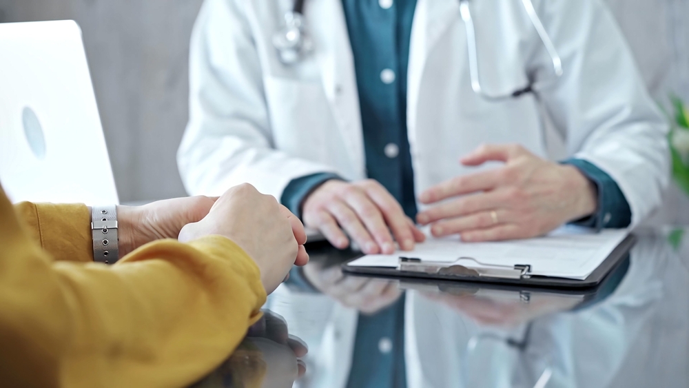 Image of a doctor assessing a patient after a car accident, highlighting the importance of seeking medical help